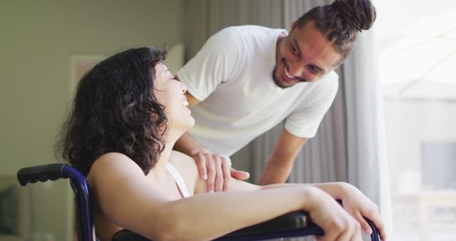 Caregiver Assisting Person in Wheelchair with a Smile in Home Setting - Download Free Stock Images Pikwizard.com