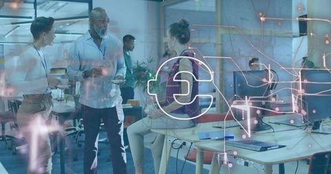 Team collaborating in open plan office with fintech network overlay and monitors