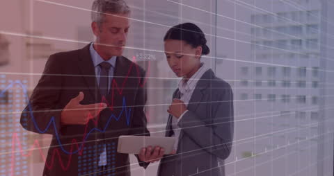 Business Professionals Analyzing Digital Financial Data on Tablet