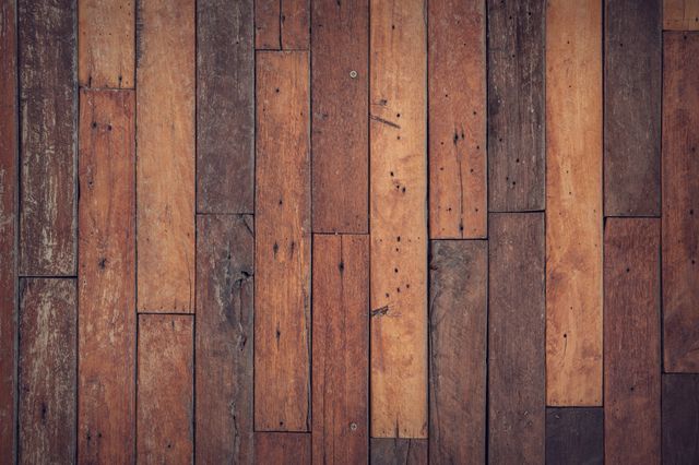Detailed rustic wooden planks floor texture featuring various shades of brown wood. Ideal for use as a background in design projects, presentations, or websites. Perfect for adding a natural, vintage, or earthy feel to branding, advertisements, or interior decoration visuals.