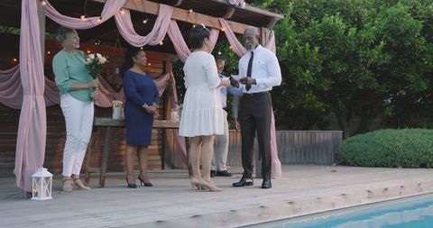 Diverse Garden Wedding Fun with Decorative Lights