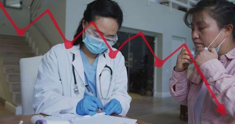 Asian Doctor Discussing COVID-19 Concerns with Patient