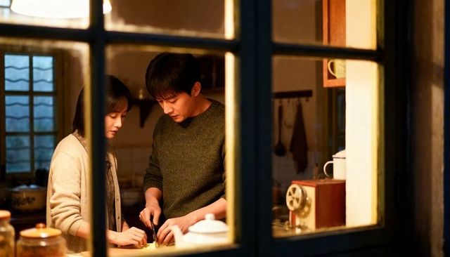 Cozy evening cooking together couple chopping vegetables at window-lit kitchen counter