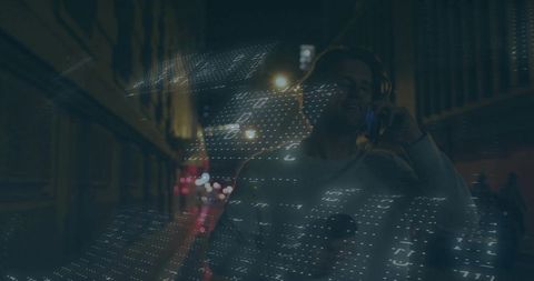 Man in Urban Nightscape with Futuristic Digital Projection