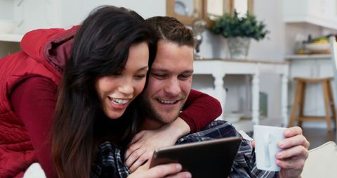 Couple Enjoying Relaxed Time at Home with Tablet and Coffee - Download Free Stock Images Pikwizard.com
