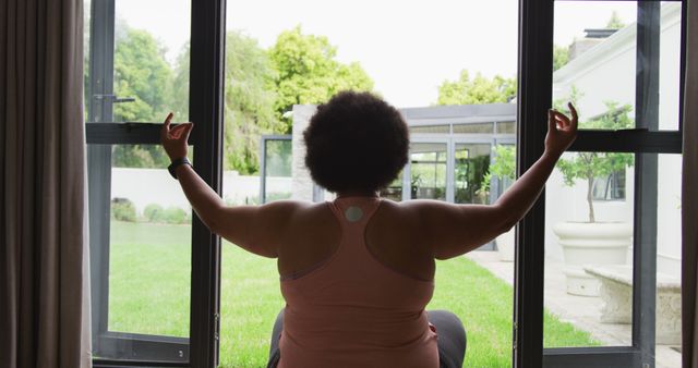 Image of back of plus size african american woman exercising at home, practicing yoga - Download Free Stock Photos Pikwizard.com