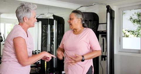 Senior Couple Celebrating Fitness Journey at Home Gym