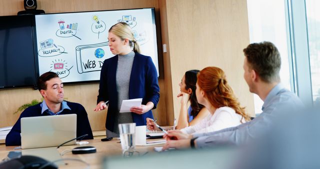 Businesswoman Giving Presentation in Modern Office Meeting - Download Free Stock Images Pikwizard.com