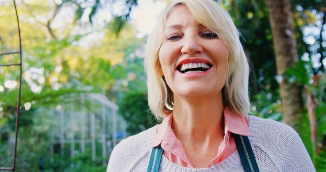 Happy Blond Woman Smiling in Garden - Download Free Stock Images Pikwizard.com