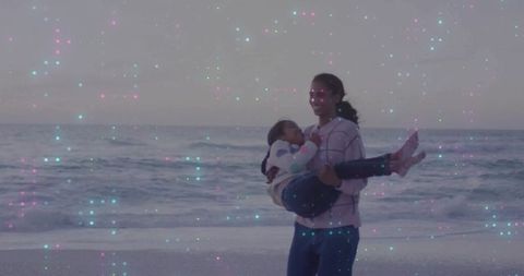 Mother and child bonding at sunset beach with magical effects