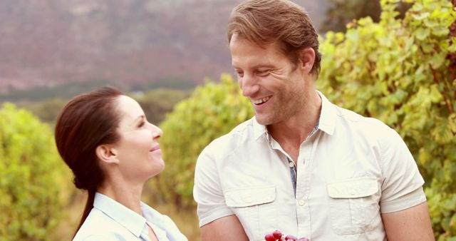 Smiling Couple Enjoying Time Together in Vineyard - Download Free Stock Images Pikwizard.com