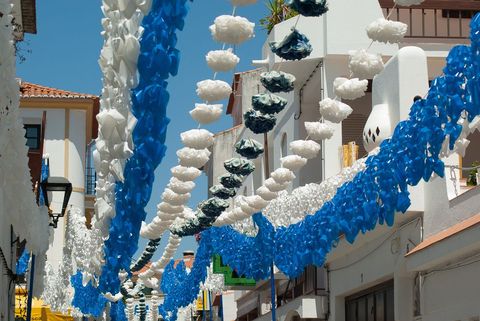 Festive decoration and blue skies alley view in southern europe
