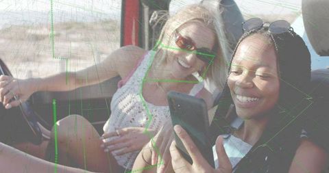 Friends Taking Selfie on Road Trip in Desert Convertible