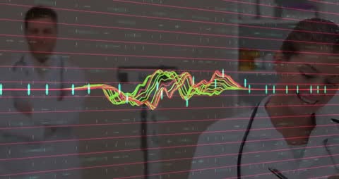 Doctors Analyzing Data with Digital Waveforms in Hospital Setting
