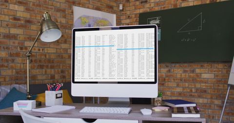 Modern Office Desk with Computer Running Data Analysis - Download Free Stock Images Pikwizard.com