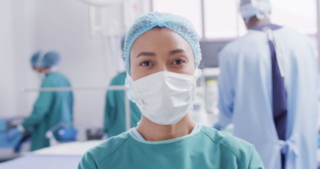 Female Surgeon Wearing Mask in Operating Room with Medical Team - Download Free Stock Images Pikwizard.com