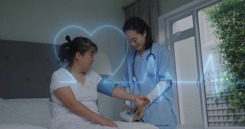 Nurse Measuring Blood Pressure for Female Patient at Home Visit