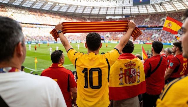 Spanish football fans cheering in stadium wearing number 10 jersey and waving scarves