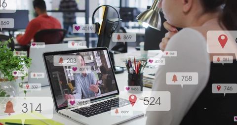 Professional collaborating in open office with digital connection