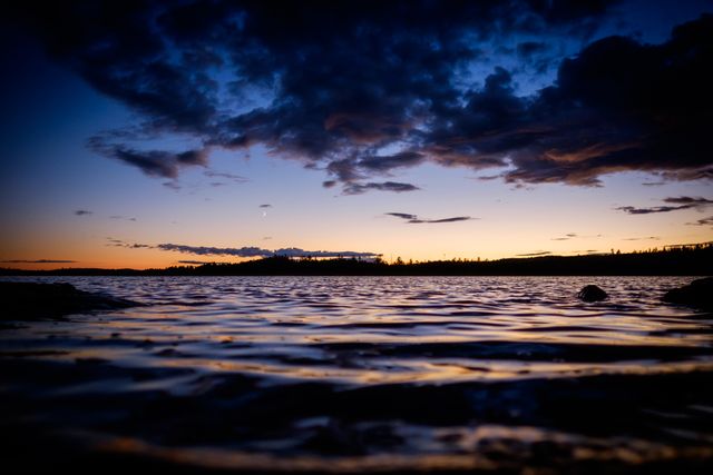 Calm Lake at Sunset with Dramatic Clouds and Reflective Water - Download Free Stock Photos Pikwizard.com