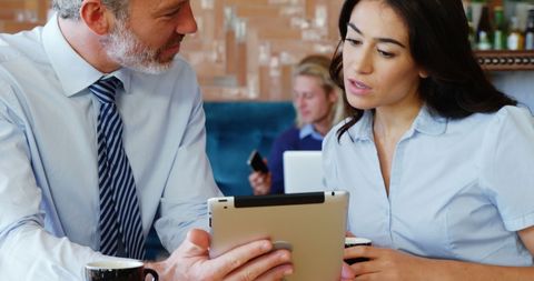 Business Professionals Engaged in Casual Meeting with Digital Tablet - Download Free Stock Images Pikwizard.com