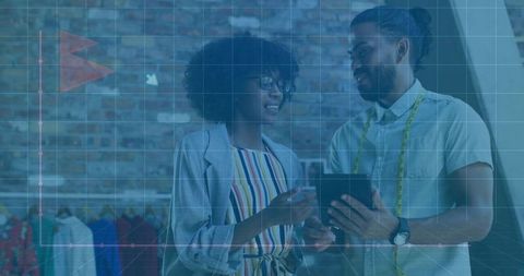 Fashion Designers Collaborating with Digital Technology in Boutique Store