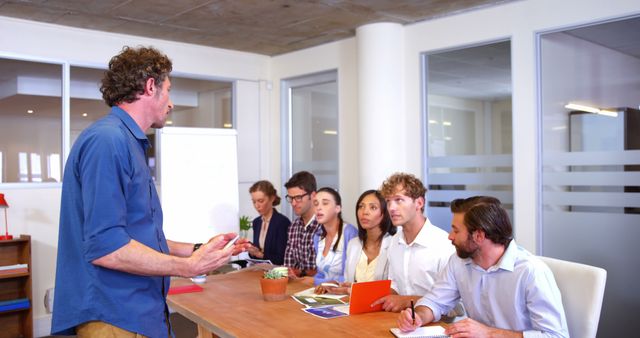 Business Coach Training Group of Diverse Team with Notebooks in Office Meeting Room - Download Free Stock Images Pikwizard.com