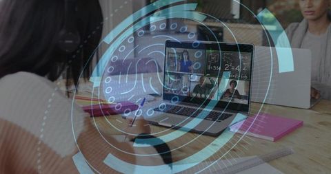 Teen Student Taking Notes During Virtual Class with Holographic Overlay for Remote Learning