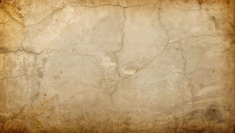 Aged plaster wall revealing hairline cracks peeling paint rustic sepia textured backdrop