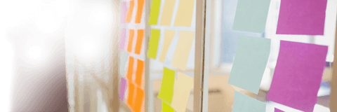 Transparent Glass Office Wall with Colorful Sticky Notes