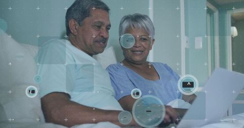 Senior Couple Enjoying Laptop Connection with Digital Network Overlay