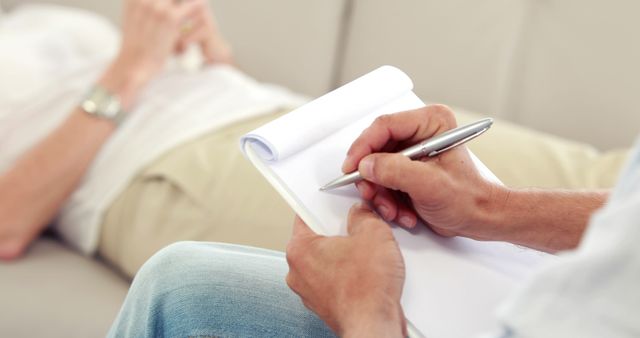 Therapist Taking Notes During Patient Counseling Session - Download Free Stock Images Pikwizard.com