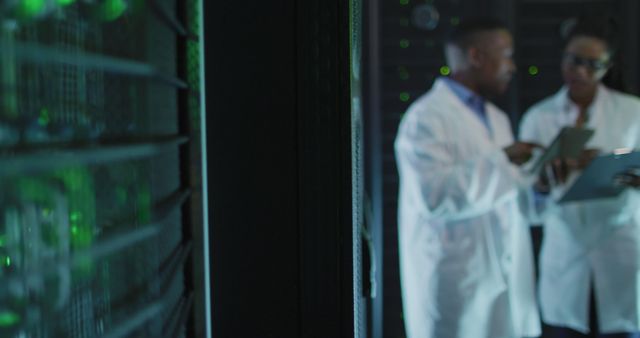 Scientists working with data servers in laboratory - Download Free Stock Photos Pikwizard.com