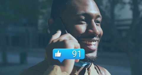 Man Communicating on Smartphone with Digital 'Like' Counter