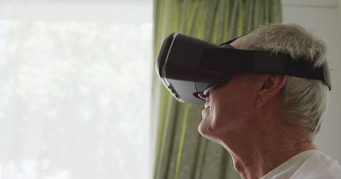Senior Man Engaged with Virtual Reality Technology at Home - Download Free Stock Images Pikwizard.com