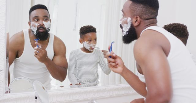 Father Teaching Son to Shave in Bathroom Mirror, Bonding Moment - Download Free Stock Images Pikwizard.com