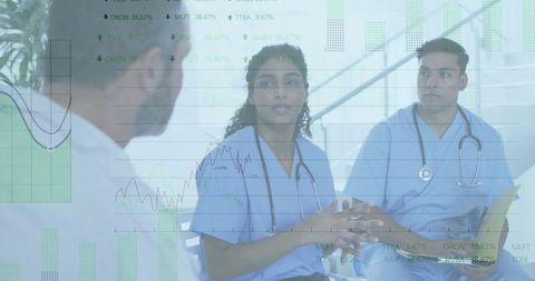 Medical professionals discussing data analysis in hospital setting