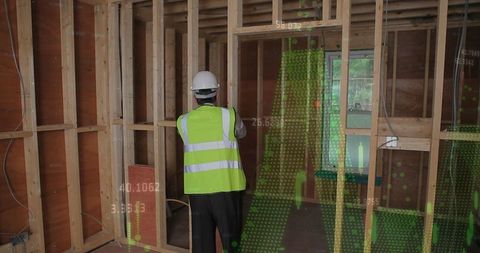 Engineer analyzing data at construction site with digital overlay