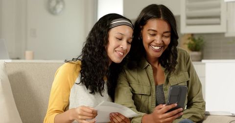 Mother and Daughter Enjoying Connection with Technology at Home