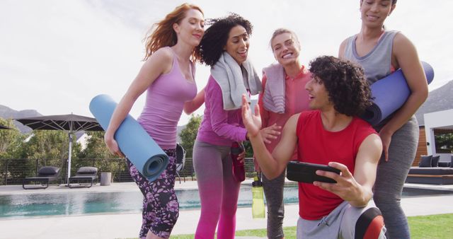 Happy group of diverse friends holding yoga mats and taking selfie - Download Free Stock Photos Pikwizard.com