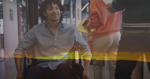 Inclusive workplace scene with wheelchair user in modern office