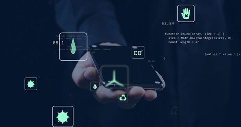 Business Hand Holding Smartphone Displaying Holographic Eco Icons and Code for Clean Energy