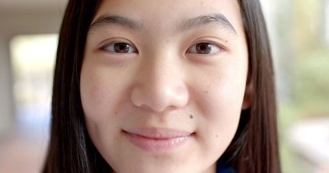 Close-up Portrait of Smiling Teenage Girl in Natural Light