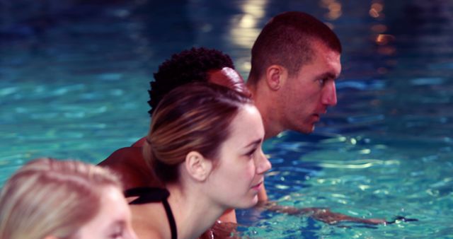 Focused Swimmers Preparing for Competition in Pool - Download Free Stock Images Pikwizard.com