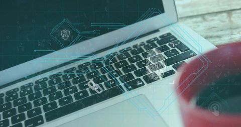Laptop keyboard running biometric fingerprint scan with holographic cybersecurity overlay and red mu