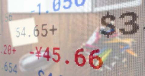 Blurred digital finance interface over office workspace