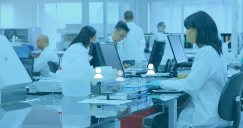 Healthcare Professionals Collaborating in Modern Lab with Digital Interface