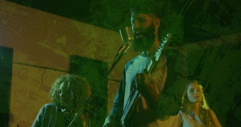 Bearded guitarist in dynamic club performance