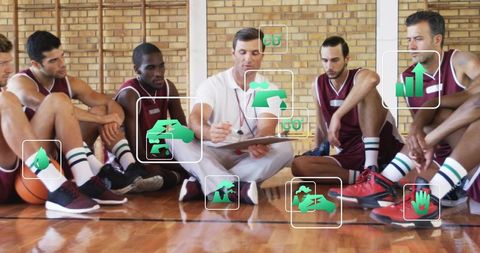 Coach leading basketball team huddle writing strategy on clipboard with analytics overlays