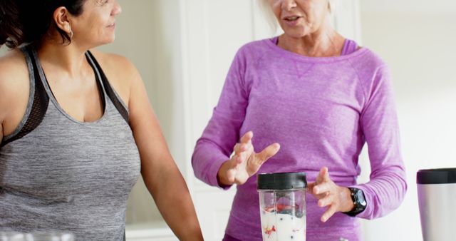 Women Preparing Smoothie Together After Workout at Home - Download Free Stock Images Pikwizard.com